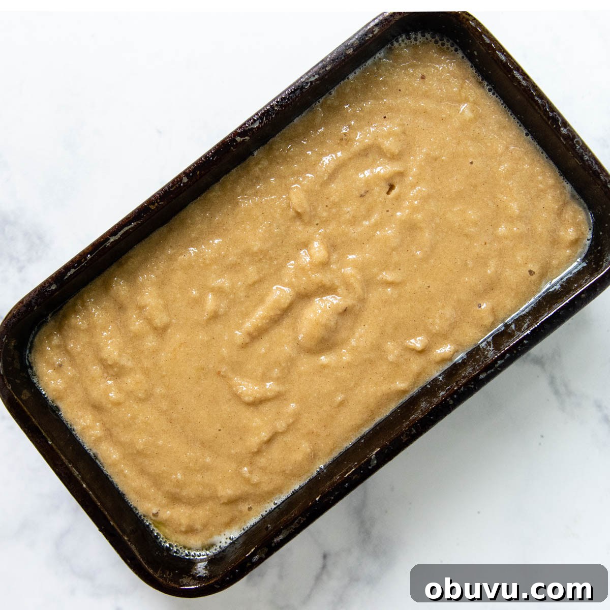 Moist Almond Flour Banana Bread Made with Oil 5 unbaked almond flour bread in a loaf pan.