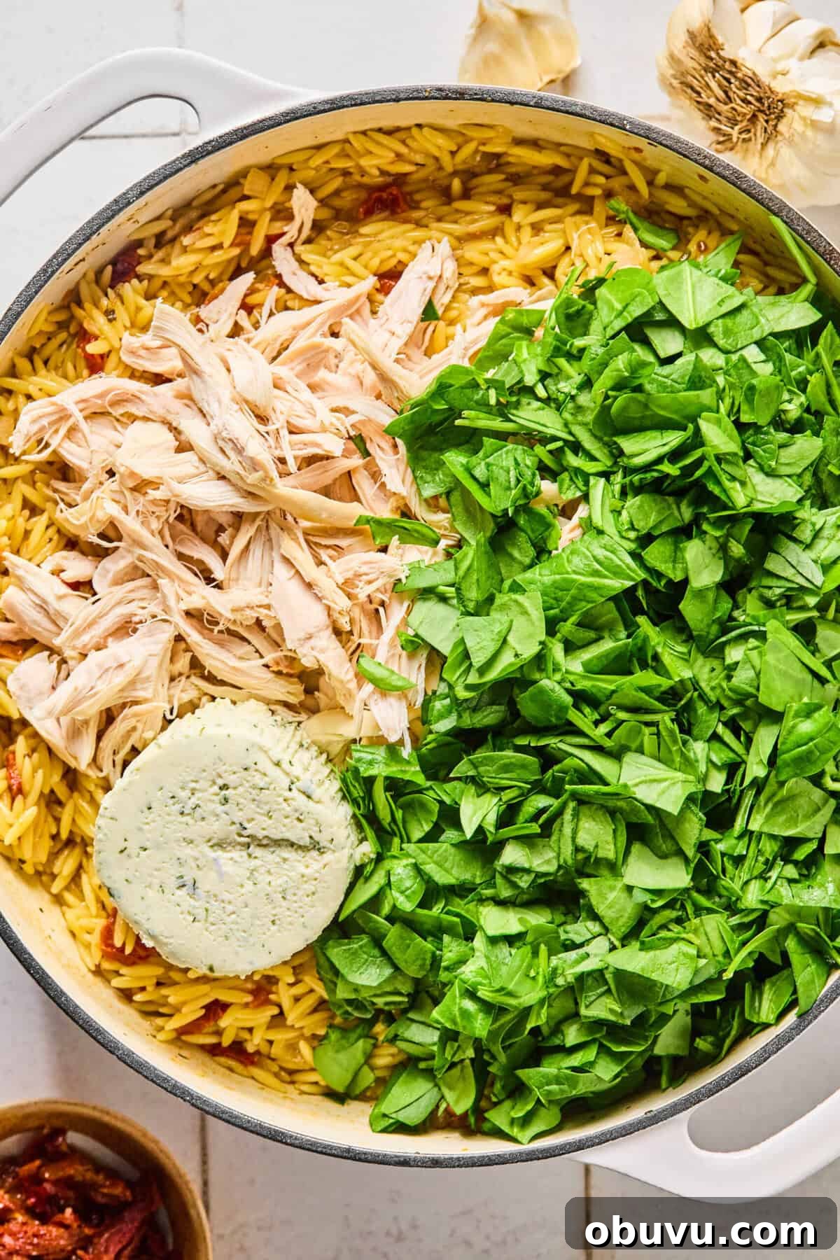 Gluten-Free Marry Me Chicken with Creamy Orzo 6 Cooked chicken, spinach, and Boursin cheese in the skillet with the creamy orzo.