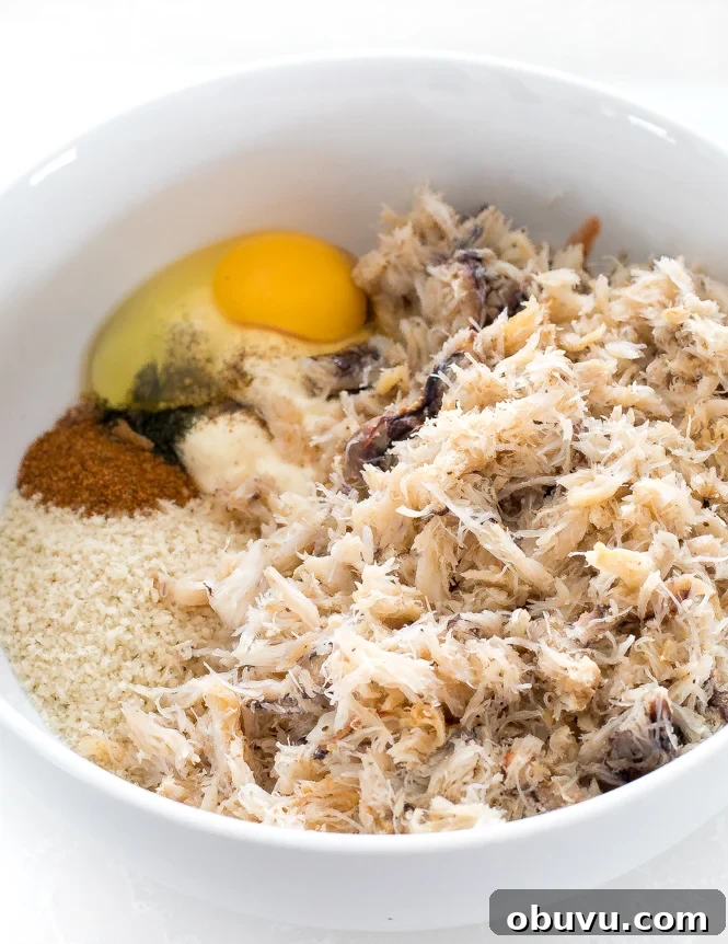 Crispy Crab Cakes with Zesty Lemon Aioli Recipe 4 top shot of shredded white meat and other ingredients in white bowl
