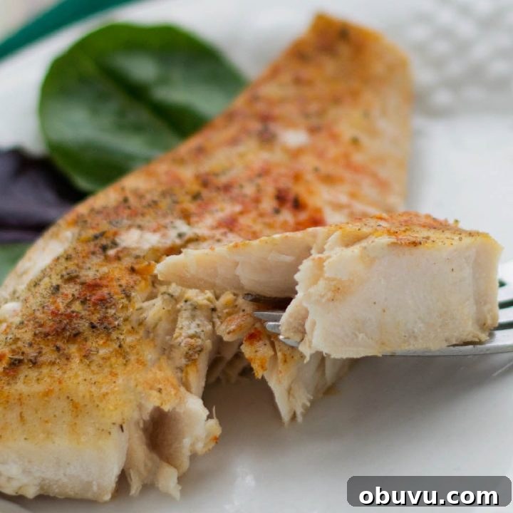 Week 13 Meal Plan: Group 2 Weekly Menu & Grocery List 7 Seasoned fish filet on a white plate with a fork lifting one bite.