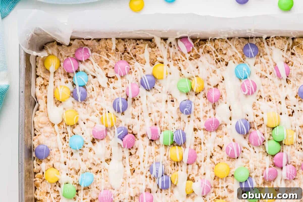 Easter Rice Krispie Treats Recipe with Colorful Spring Decorations 10 Easter Rice Krispies treats setting in a pan, before slicing.