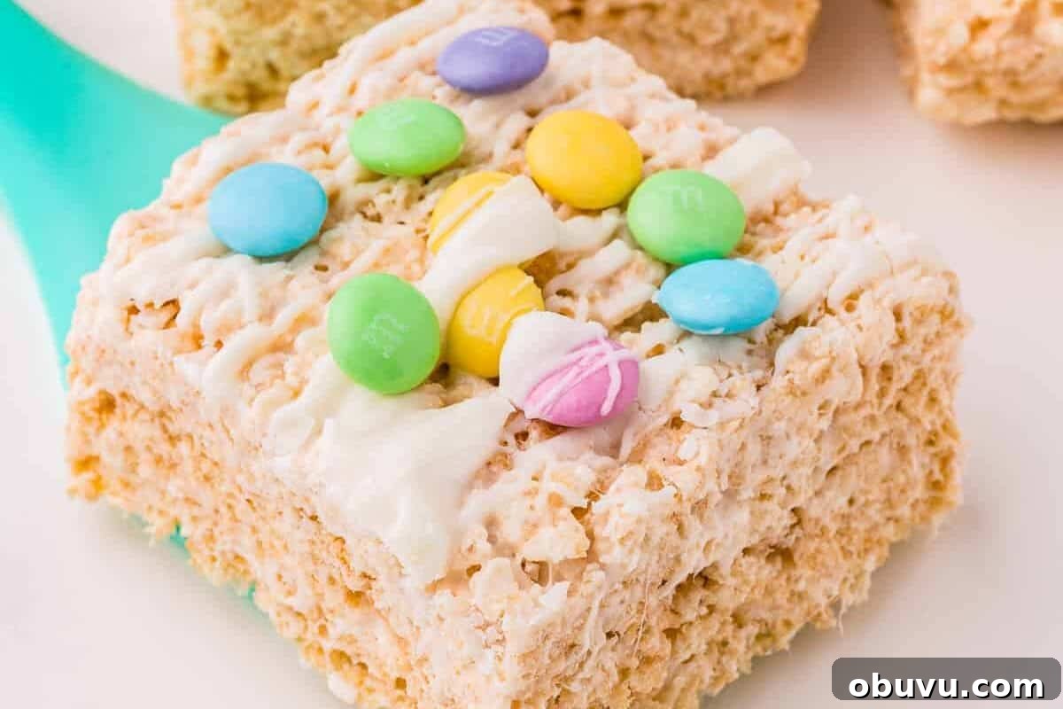Easter Rice Krispie Treats Recipe with Colorful Spring Decorations 3 A Rice Krispies Treat square topped with white chocolate and Easter M&Ms.