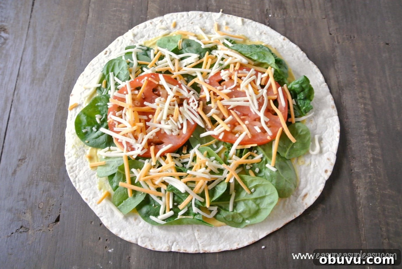 Picture-Perfect Grilled Chicken Wrap: Step-by-Step Rolling Guide 7 How to make a picture perfect wrap. Shredded or sliced cheese work equally well.