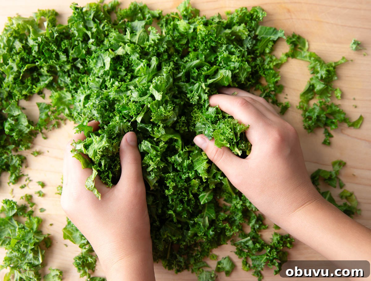 Chipotle Kale Salad Recipe with Smoky Lime Dressing 3 massaging chopped kale with olive oil and sea salt