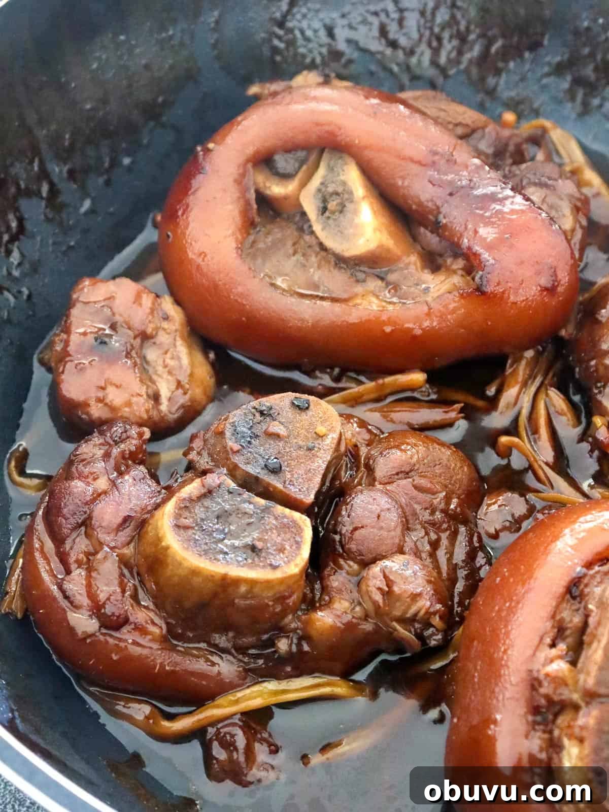 Filipino Pork Hock Paksiw Recipe – Tangy Vinegar Stew 5 patang paksiw cooked in a pan