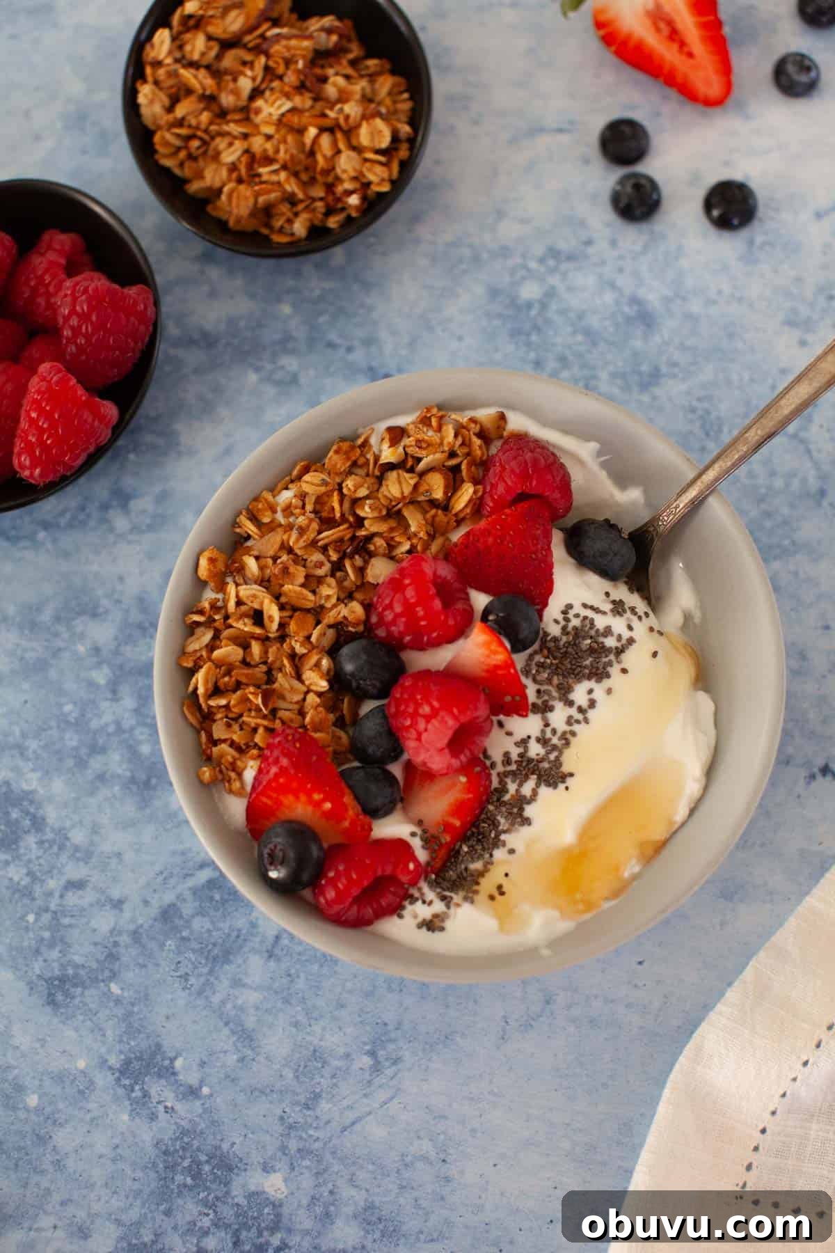 Refreshing Yogurt and Granola Bowl Recipes for Every Morning 2 Yogurt bowl with granola, chia seeds, and honey.