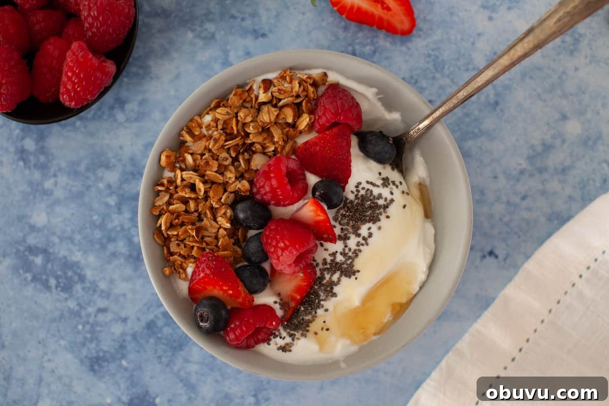 Refreshing Yogurt and Granola Bowl Recipes for Every Morning 4 A bowl of granola with berries and yogurt.