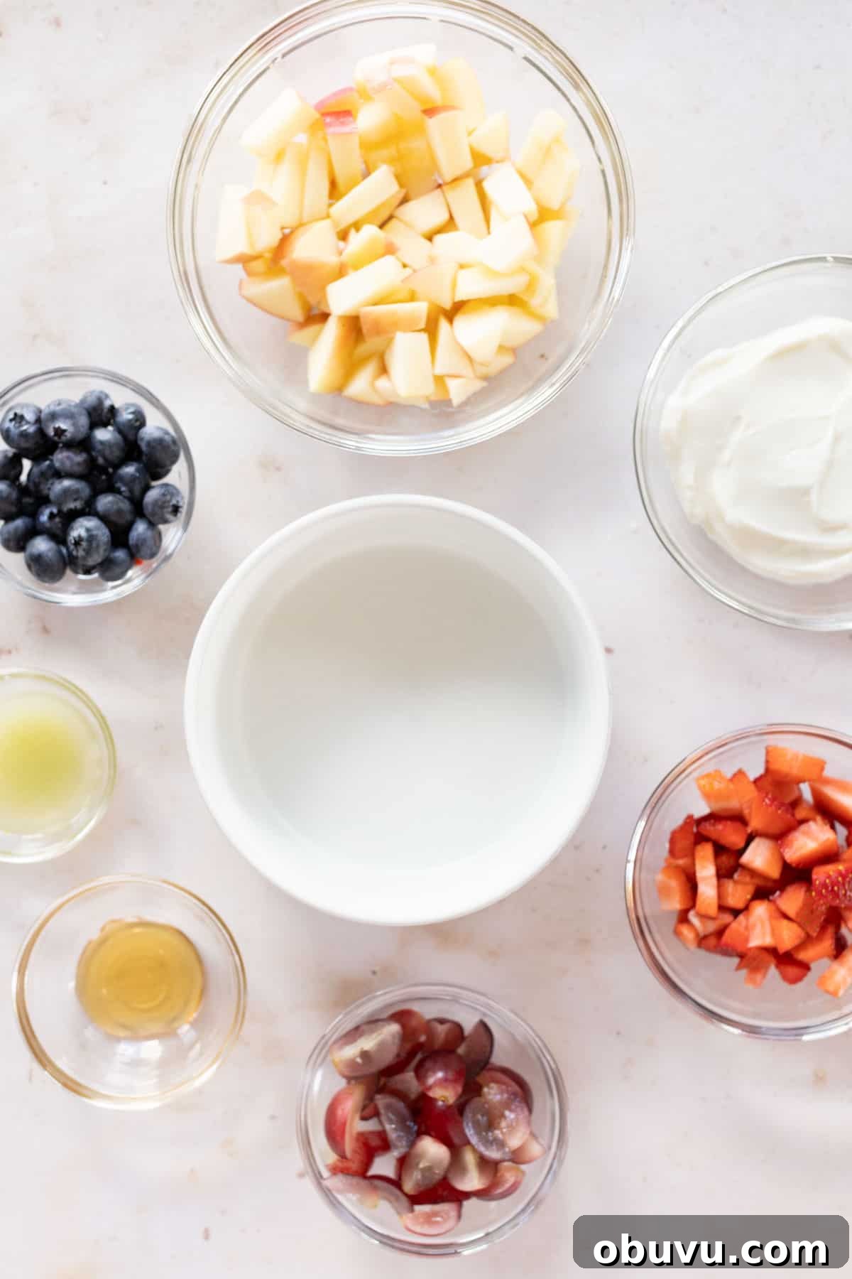 Refreshing Yogurt and Granola Bowl Recipes for Every Morning 6 Assorted ingredients for creamy fruit salad.