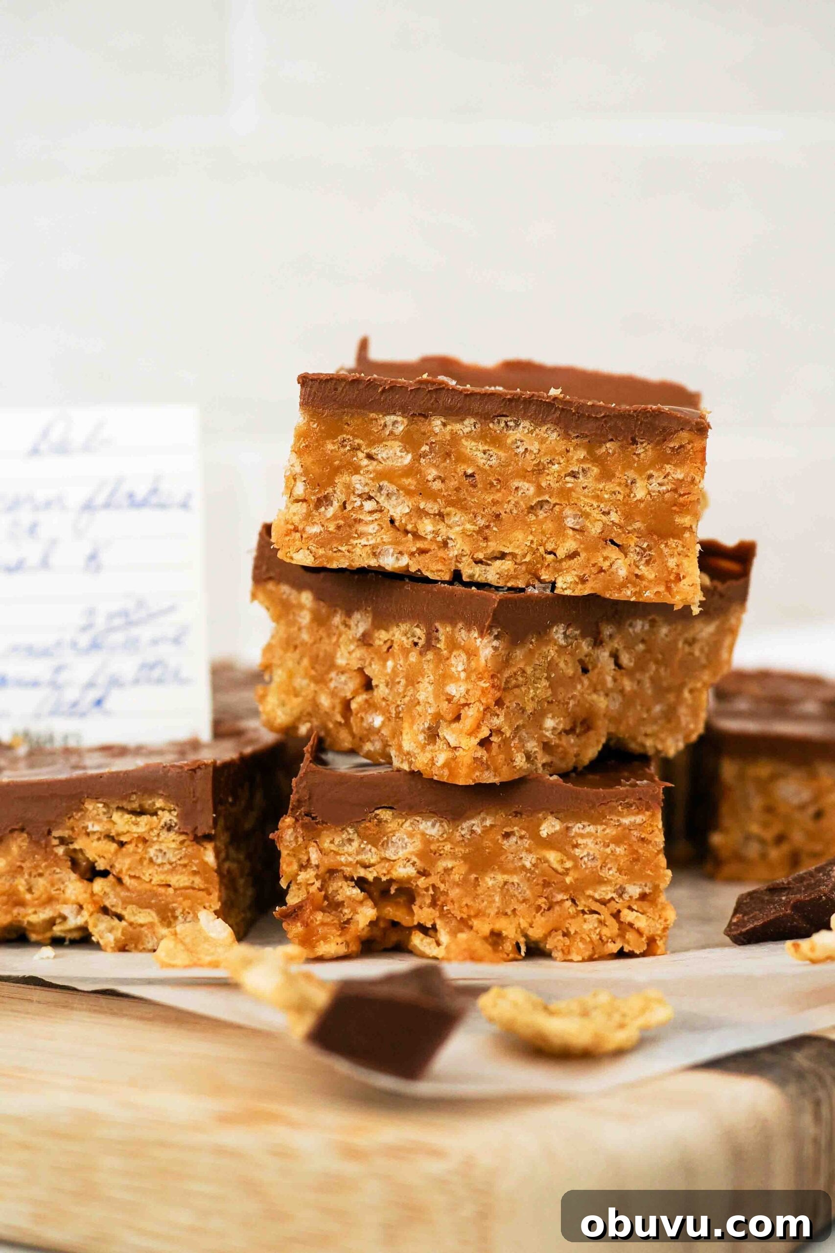 Aunt Deb’s Special K Bars Recipe — Crispy Cereal Treats 2 A stack of three Special K bars with a corner of a recipe visible in the background.