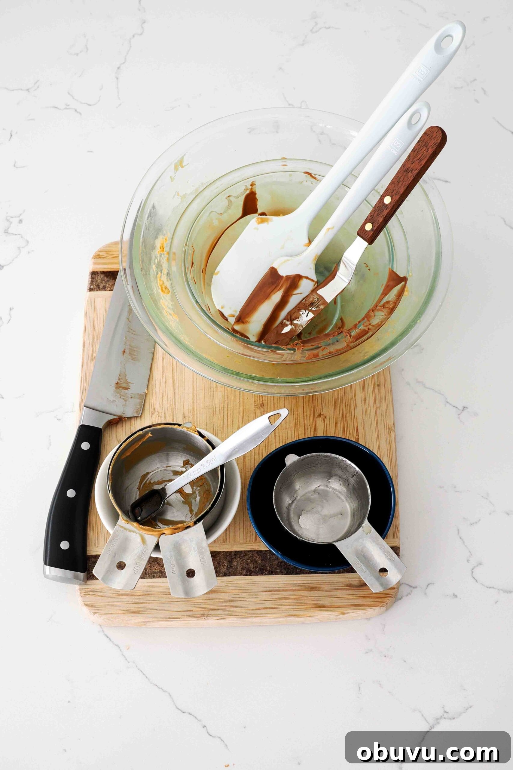 Aunt Deb’s Special K Bars Recipe — Crispy Cereal Treats 11 Dishes used to make Special K bars on a quartz counter.