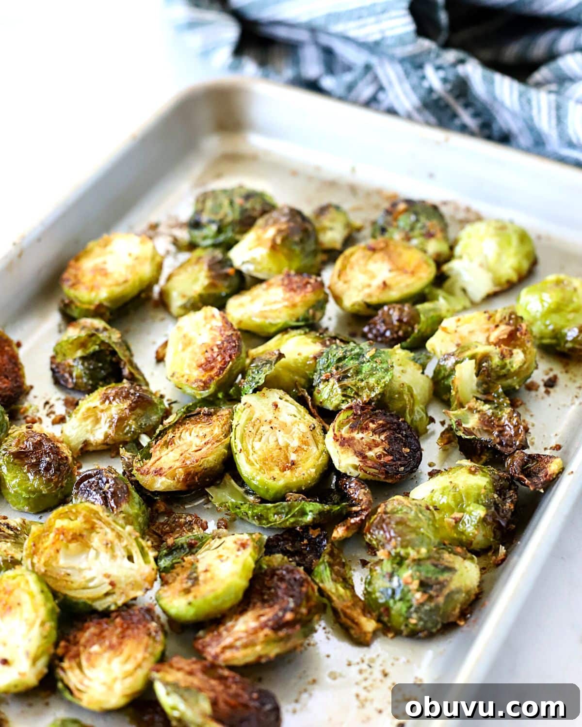Crispy Oven-Roasted Brussels Sprouts with Balsamic Glaze 2 Roasted Brussels sprouts on a baking pan right out of the oven.