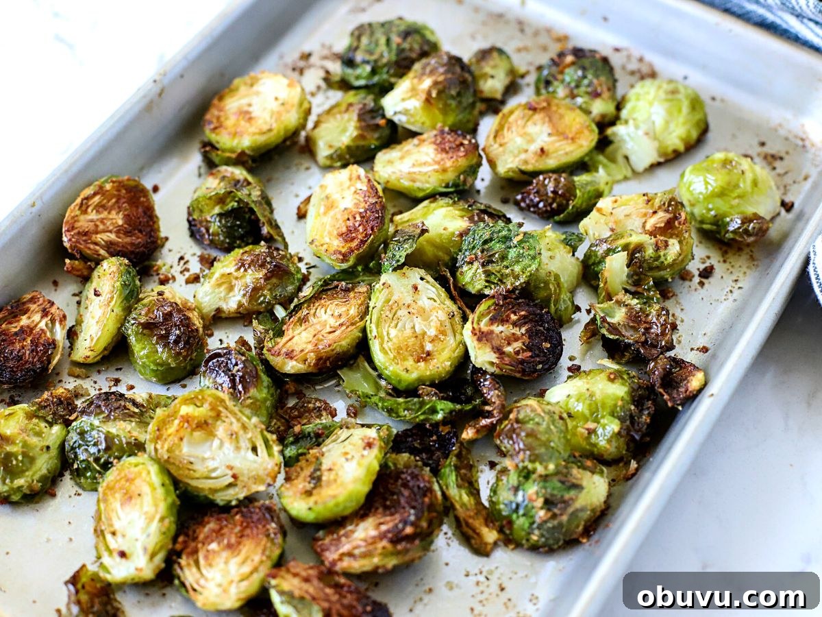 Crispy Oven-Roasted Brussels Sprouts with Balsamic Glaze 9 A Baking tray full of roasted Brussels Sprouts.