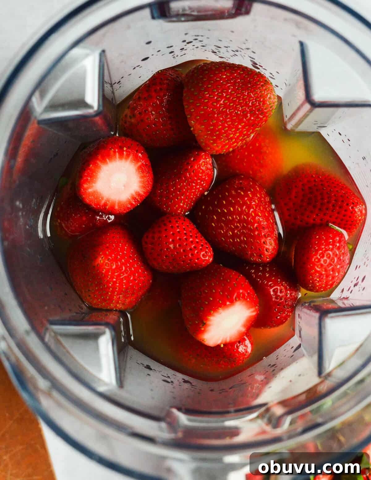 Strawberry & Passion Fruit Granita Recipe for Summer Refreshment 4 strawberries and passion fruit juice in a blender.