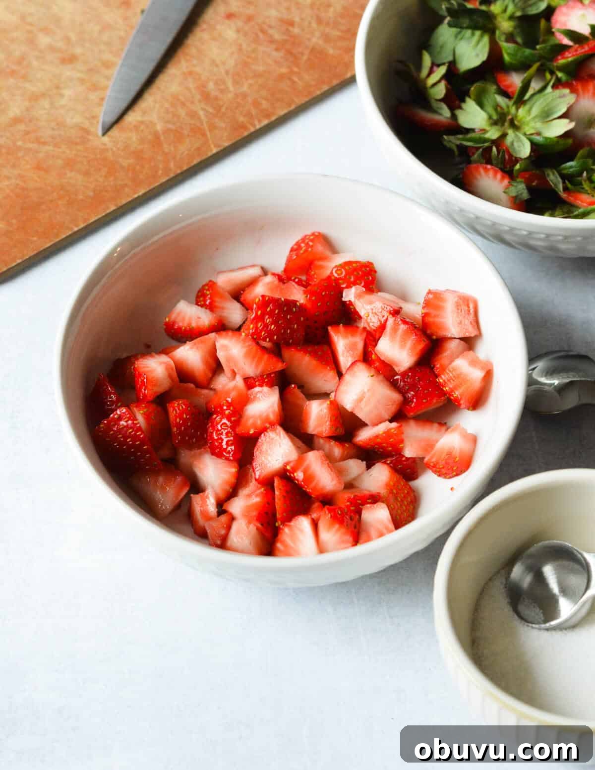 Strawberry & Passion Fruit Granita Recipe for Summer Refreshment 10 a bowl of diced strawberries.