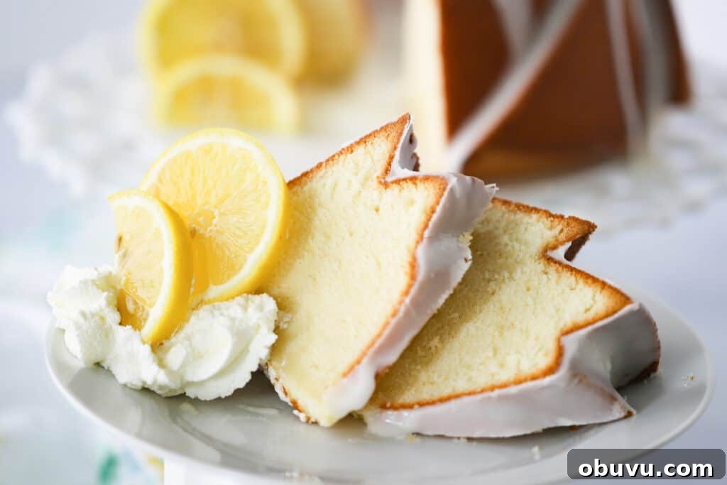 Classic Lemon Pound Cake Recipe — Moist & Zesty Slice 3 Slices of cream cheese lemon pound cake on a white plate with fresh lemon and whipped cream.