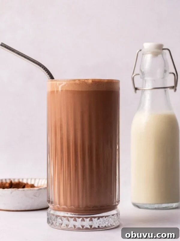Chewy Peanut Butter Blondies Recipe for Rich, Gooey Bars 8 Peanut Butter Milkshake next to milk in a glass bottle.