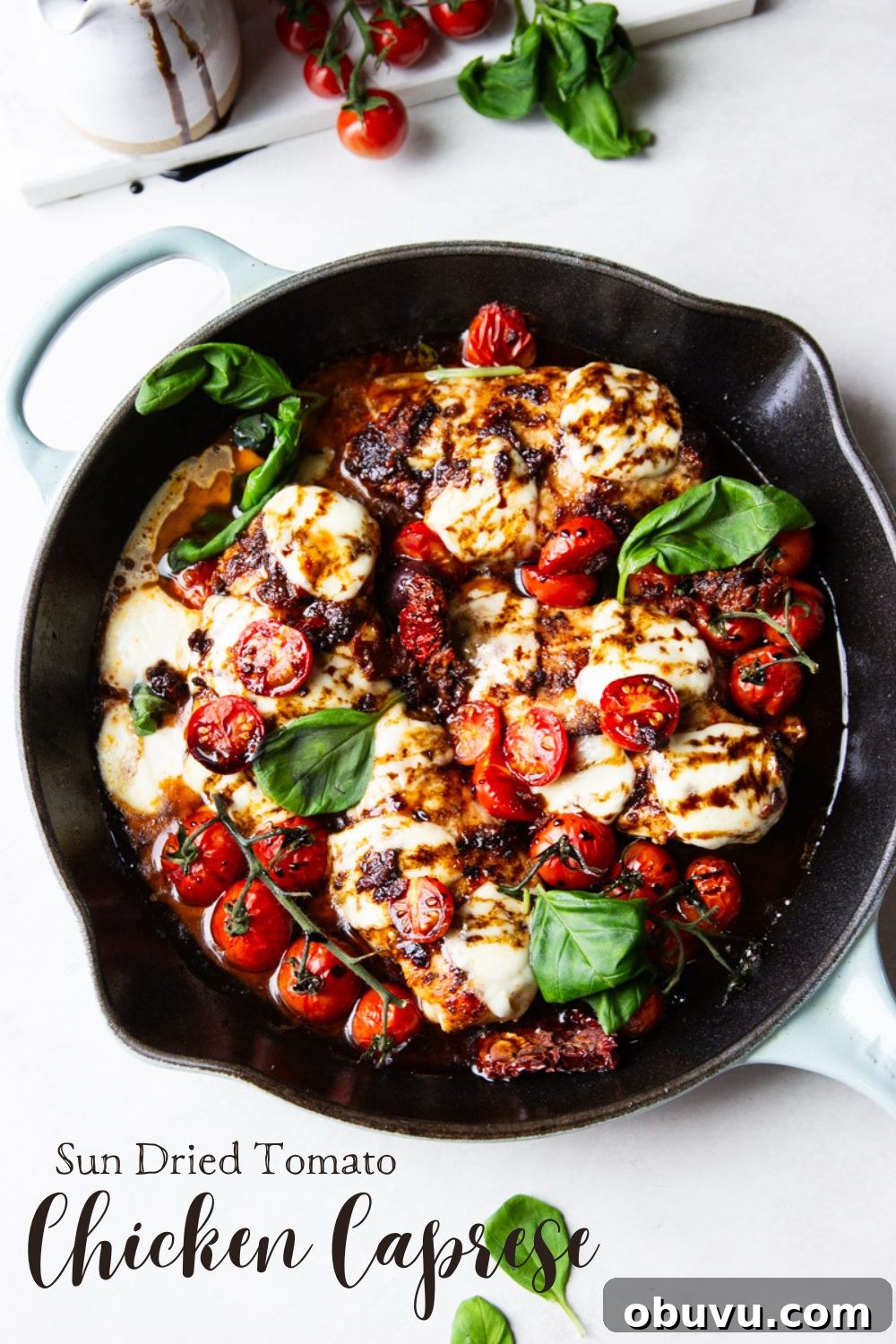 Sun-Dried Tomato Chicken Caprese Recipe with Fresh Basil 16 Cast iron skillet with balsamic glazed chicken, tomatoes, fresh mozzarella and basil.