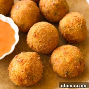 a close up image of cheese balls to showcase their crispy texture