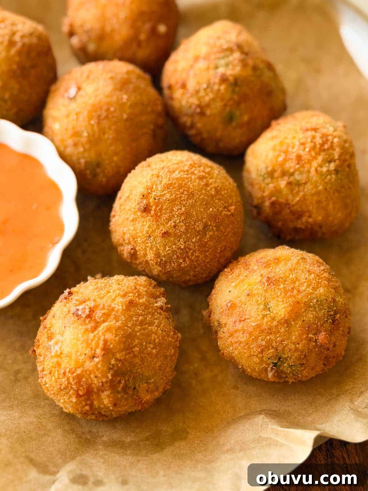 a close up image of cheese balls to showcase their crispy texture