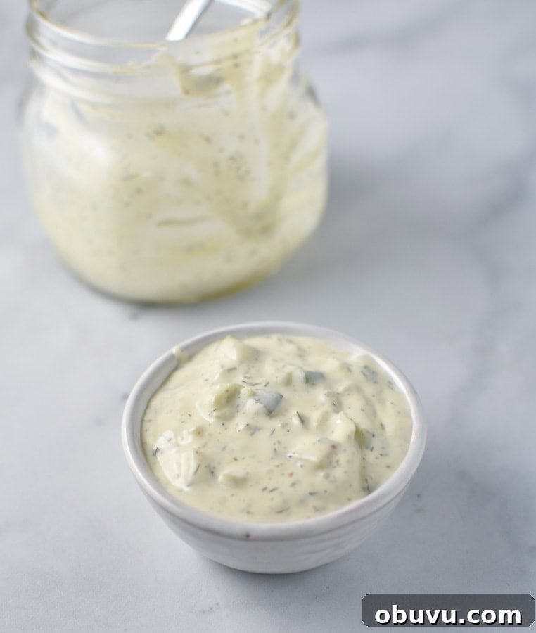 Whole30-Friendly Tartar Sauce Recipe for Seafood and Dips 2 A mixture of mayo, cucumbers, dill, and capers for homemade whole30 tartar sauce in a bowl
