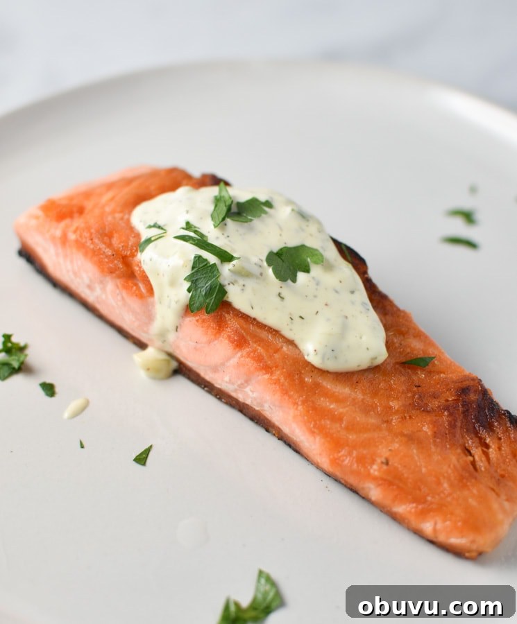 Whole30-Friendly Tartar Sauce Recipe for Seafood and Dips 4 Seared salmon topped with tartar sauce on a grey plate