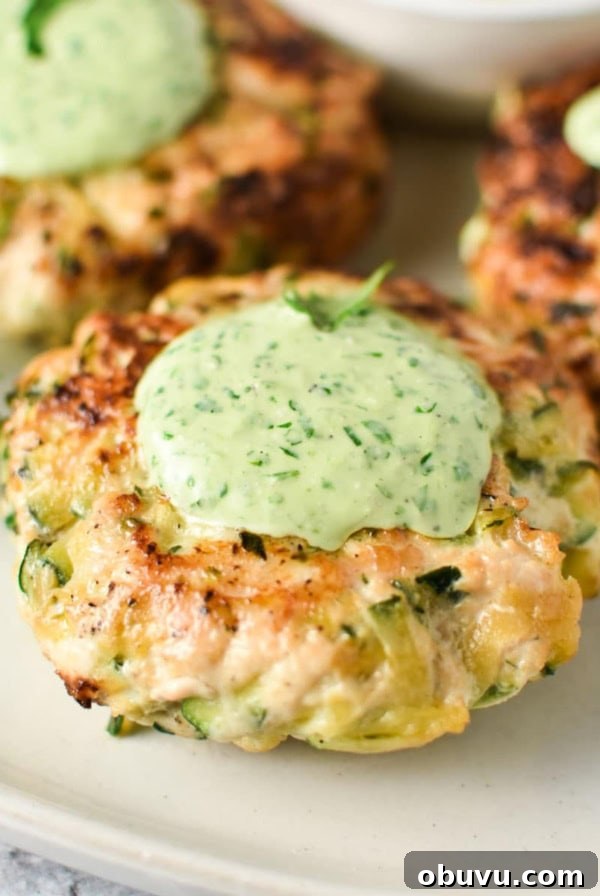 Chicken zucchini poppers topped with a green cilantro sauce.