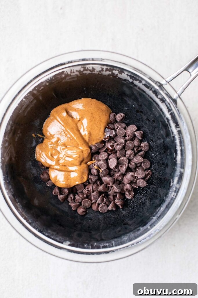 Chocolate chips and almond butter in a double boiler.
