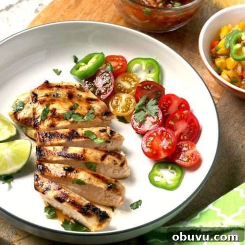 Tequila-Lime Margarita Chicken Recipe with Zesty Marinade 5 Sliced grilled chicken on a white plate.