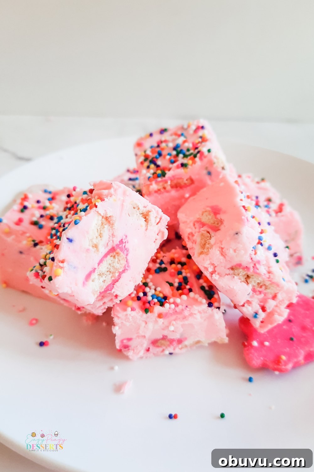Strawberry Funfetti Fudge Recipe: Colorful No-Bake Treat 3 A few squares of funfetti fudge with strawberry frosting, sprinkled and circus cookies