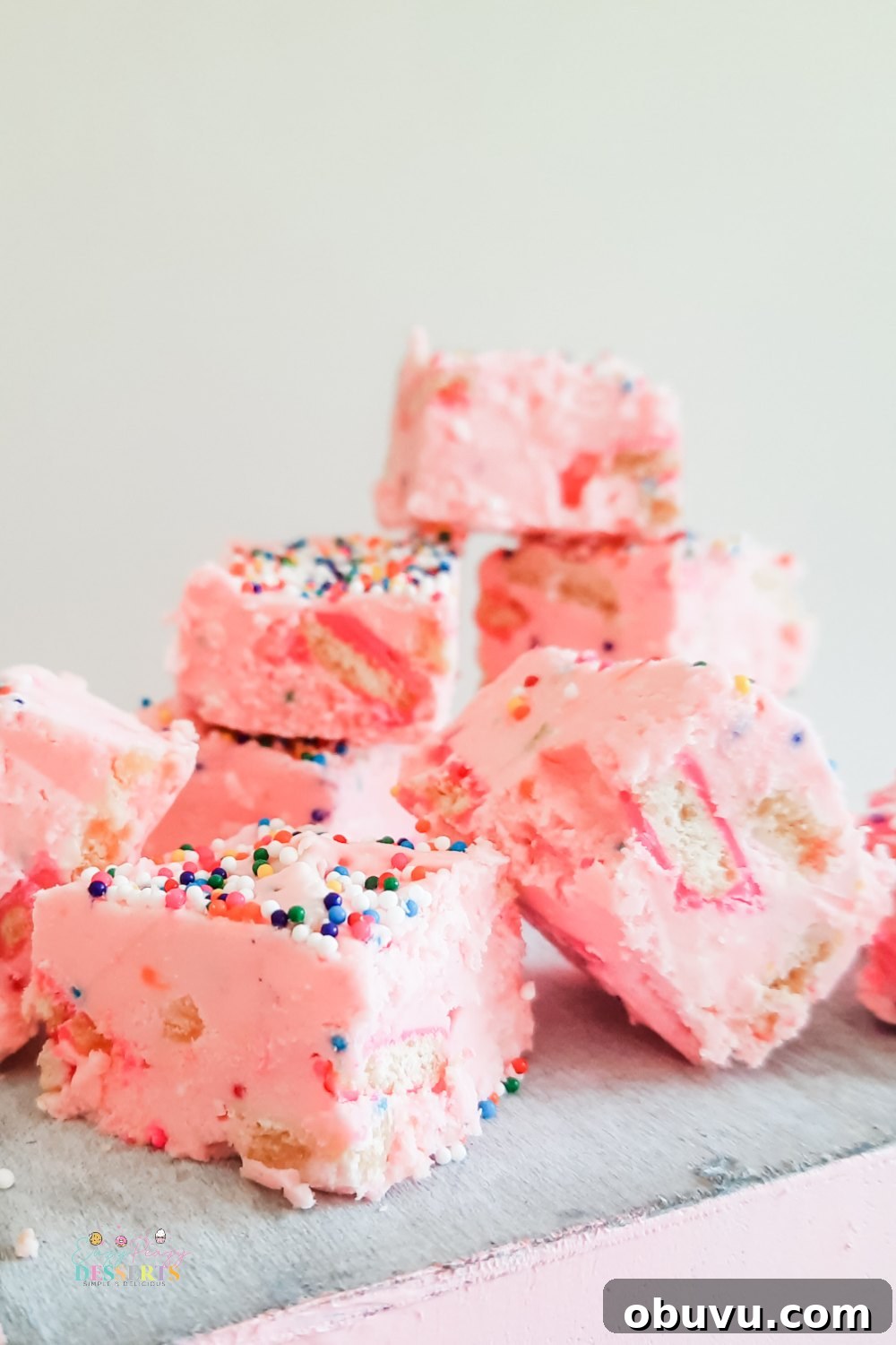 Strawberry Funfetti Fudge Recipe: Colorful No-Bake Treat 5 A few squares of strawberry funfetti fudge with circus cookies