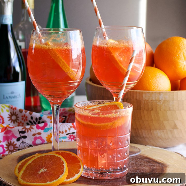 Aperol Spritz (Spritz Veneziano) Cocktail Recipe & Guide 3 Three glasses of Aperol Spritz Cockails
