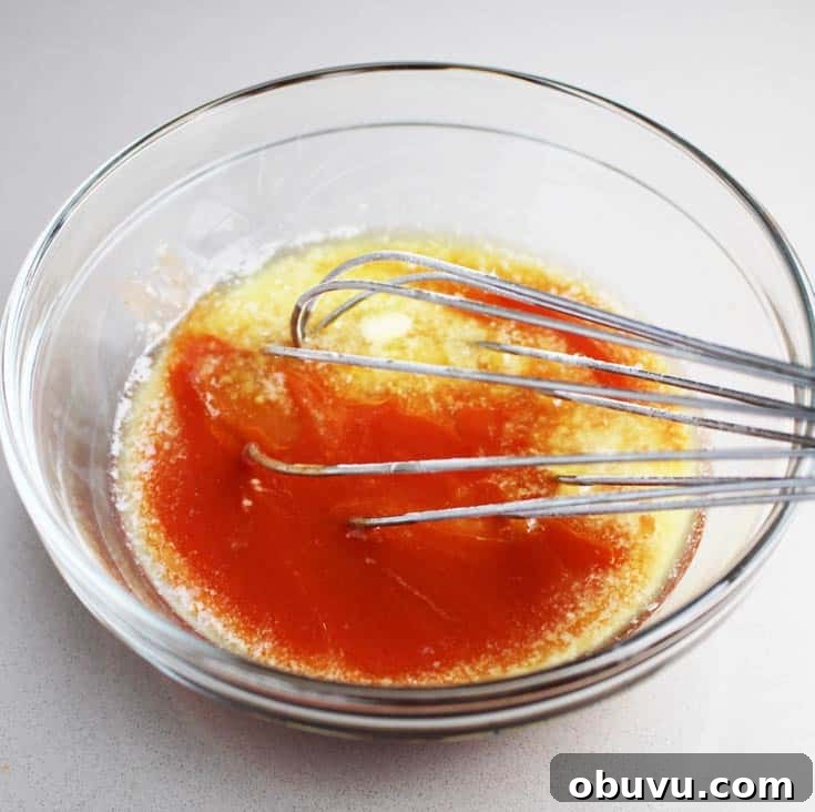 Spicy Buffalo Chicken Breast Burger Recipe 4 Hot sauce being whisked with butter for Buffalo chicken breast burgers