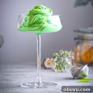 Creamy Matcha Ice Cream Recipe — Authentic Japanese Flavor 13 a glass filled with green ice cream.