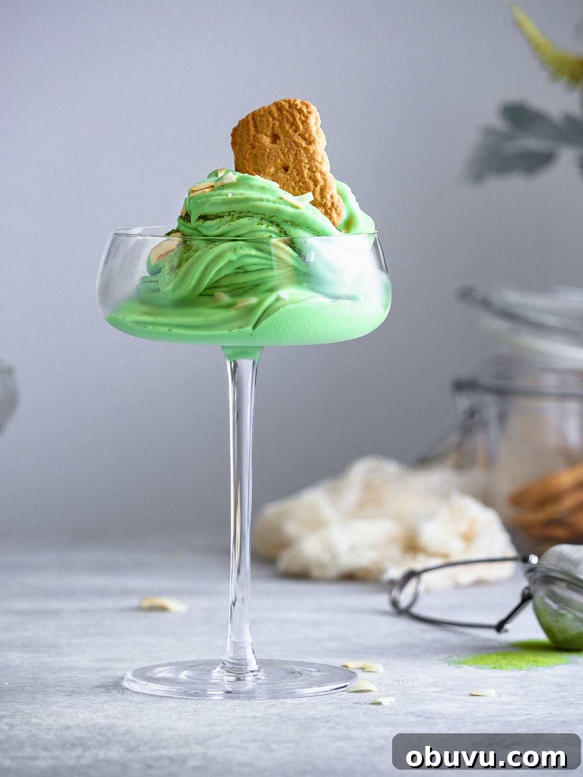 Creamy Matcha Ice Cream Recipe — Authentic Japanese Flavor 7 Milk tea ice cream served in a tall glass with cookies.