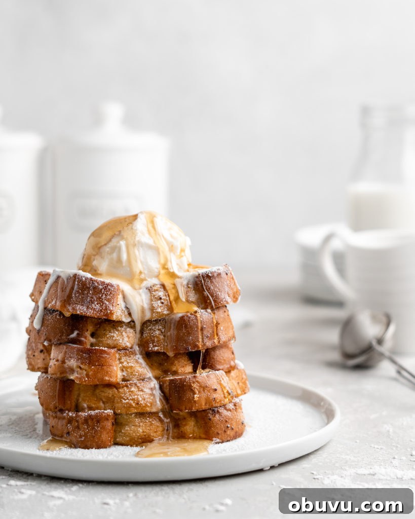 Decadent Buttermilk French Toast Recipe for Brunch 5 Thick slices of Grand Marnier infused buttermilk French Toast, topped with ice cream and syrup