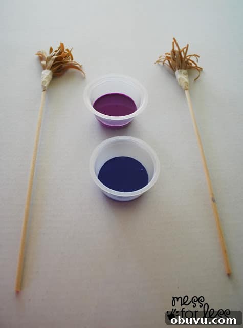 Creative Rubber Band Paintbrush Techniques for Unique Art 5 painting with rubber band paintbrushes with cups of paint