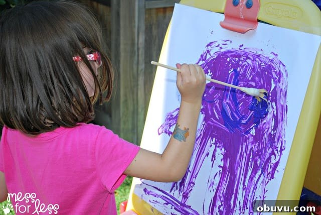 Creative Rubber Band Paintbrush Techniques for Unique Art 9 child painting with rubber band paintbrushes