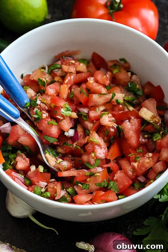 Vegan Tempeh Tacos with Savory Meat Filling 5 Fresh Tomato Salsa in a Bowl with Utencils