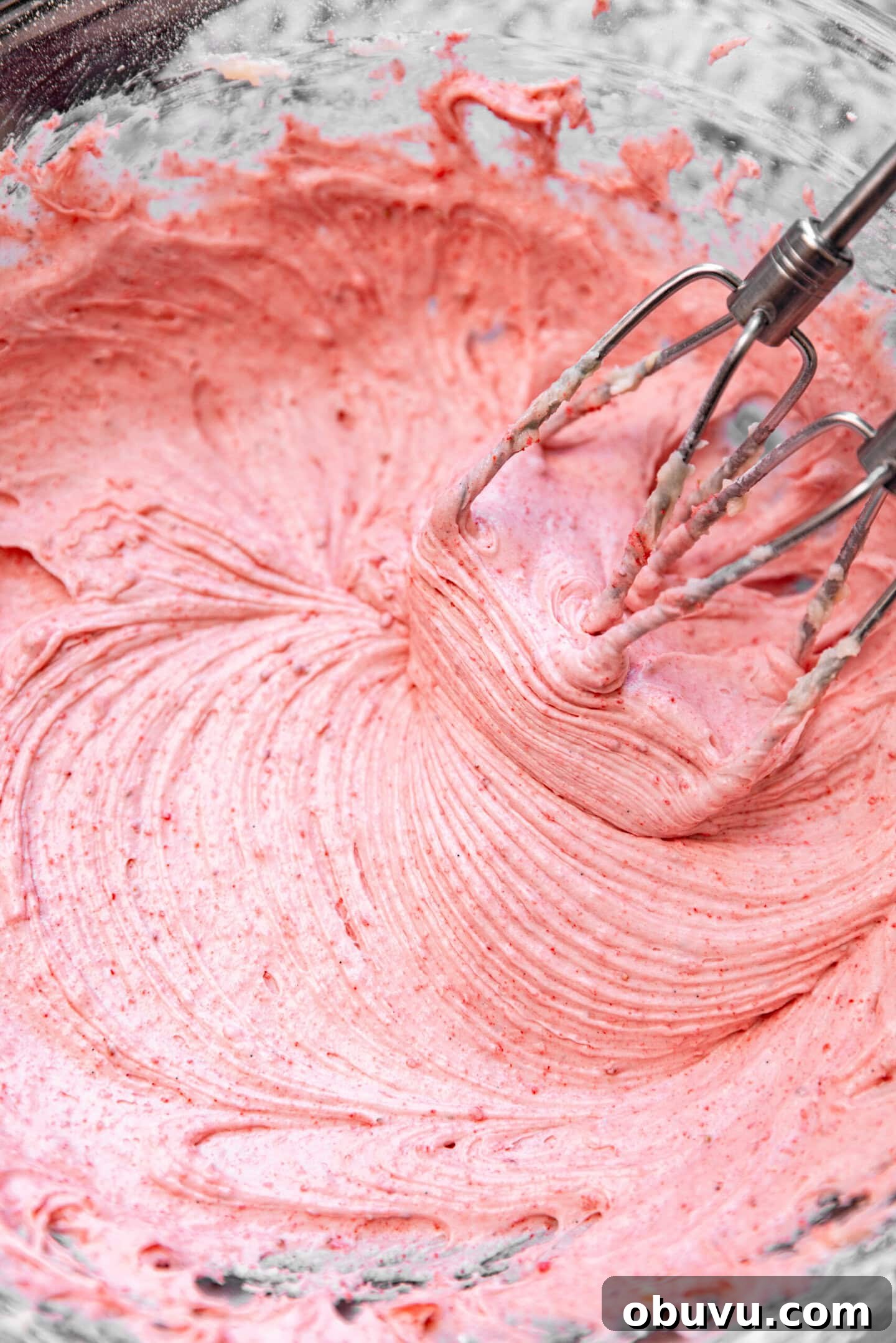 Freeze-Dried Strawberry Cream Cheese Frosting Recipe 6 Freeze-dried strawberry powder being beaten into cream cheese frosting.