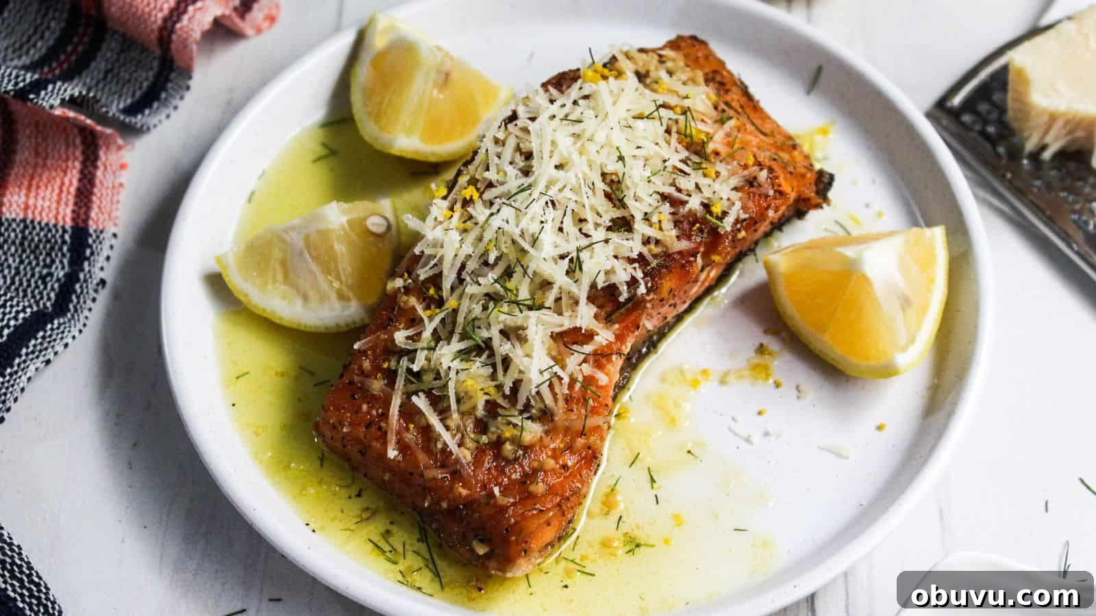29 Delicious Low-Carb Meals That Aren’t Just Salad 13 A plate of salmon on a white plate with lemon slices on it.