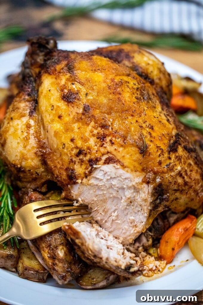 Juicy Slow-Cooker Whole Chicken with Savory Stuffing 5 Juicy crockpot whole chicken with vegetables cooked in the slow cooker.