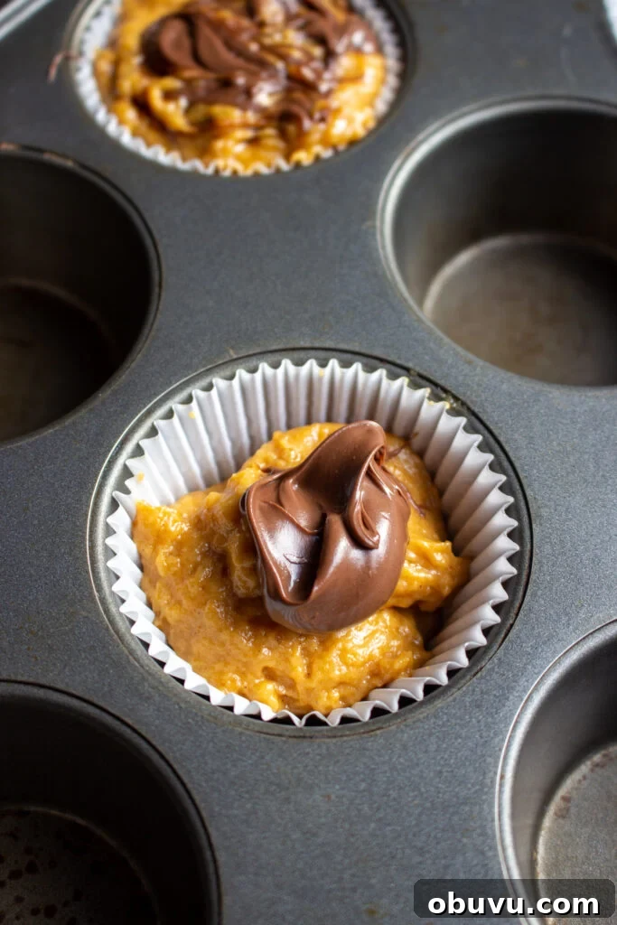 Pumpkin and Nutella Muffins Recipe for Fall Baking 6 Filling muffin liners