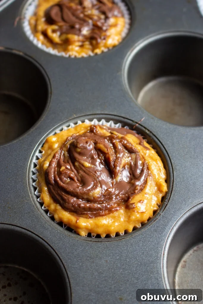 Pumpkin and Nutella Muffins Recipe for Fall Baking 7 Nutella swirls