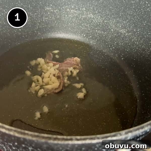 frying garlic and anchovies in a pot