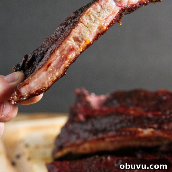 Maple Bourbon Smash Cocktail Recipe — Warm Autumn Whiskey Smash 10 traeger smoked pork spare ribs, sliced and one being held