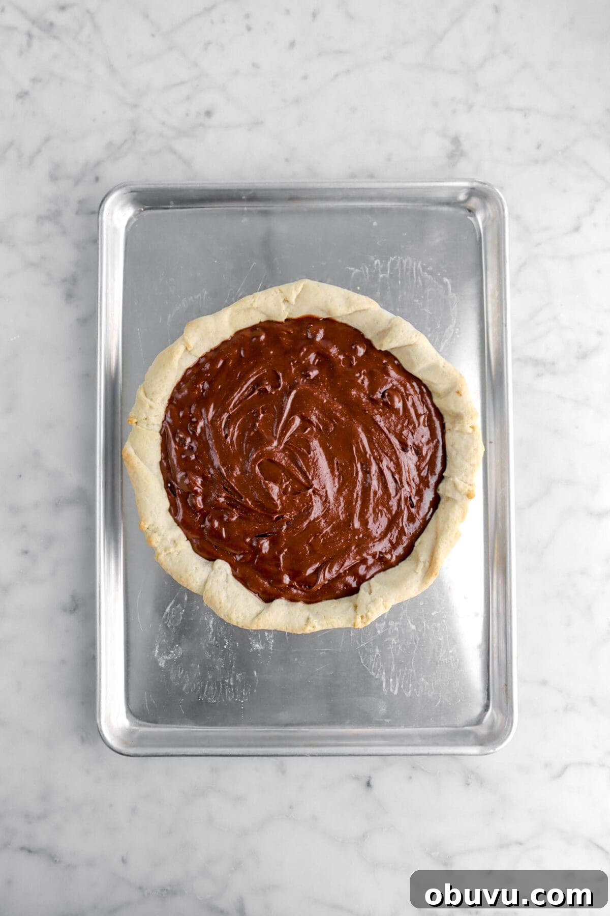 Fudgy Chocolate Chip Brownie Pie Recipe for Ooey-Gooey Dessert 9 brownie batter added to par-baked pie crust.