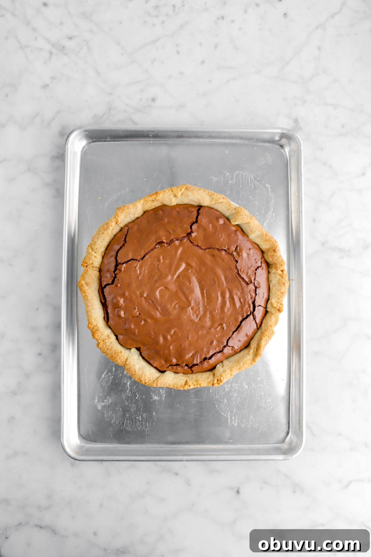 Fudgy Chocolate Chip Brownie Pie Recipe for Ooey-Gooey Dessert 10 brownie pie on metal sheet pan.