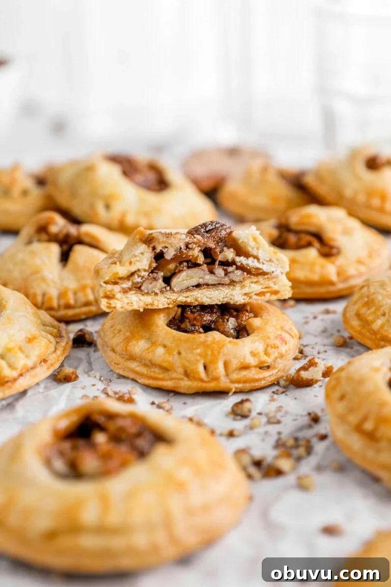 half of pecan hand pie with more hand pies around.
