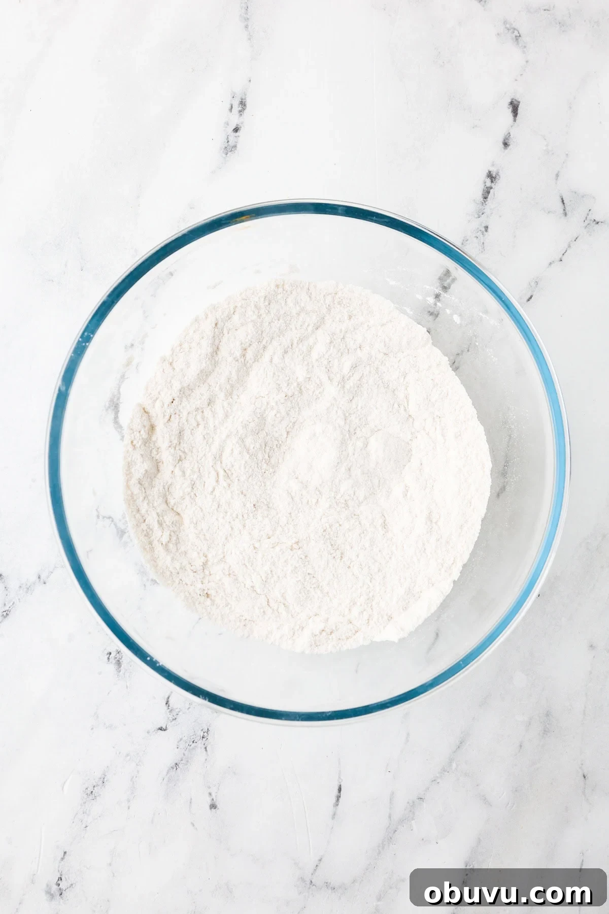 An overhead image of combining the dry ingredient mixture together in a bowl.
