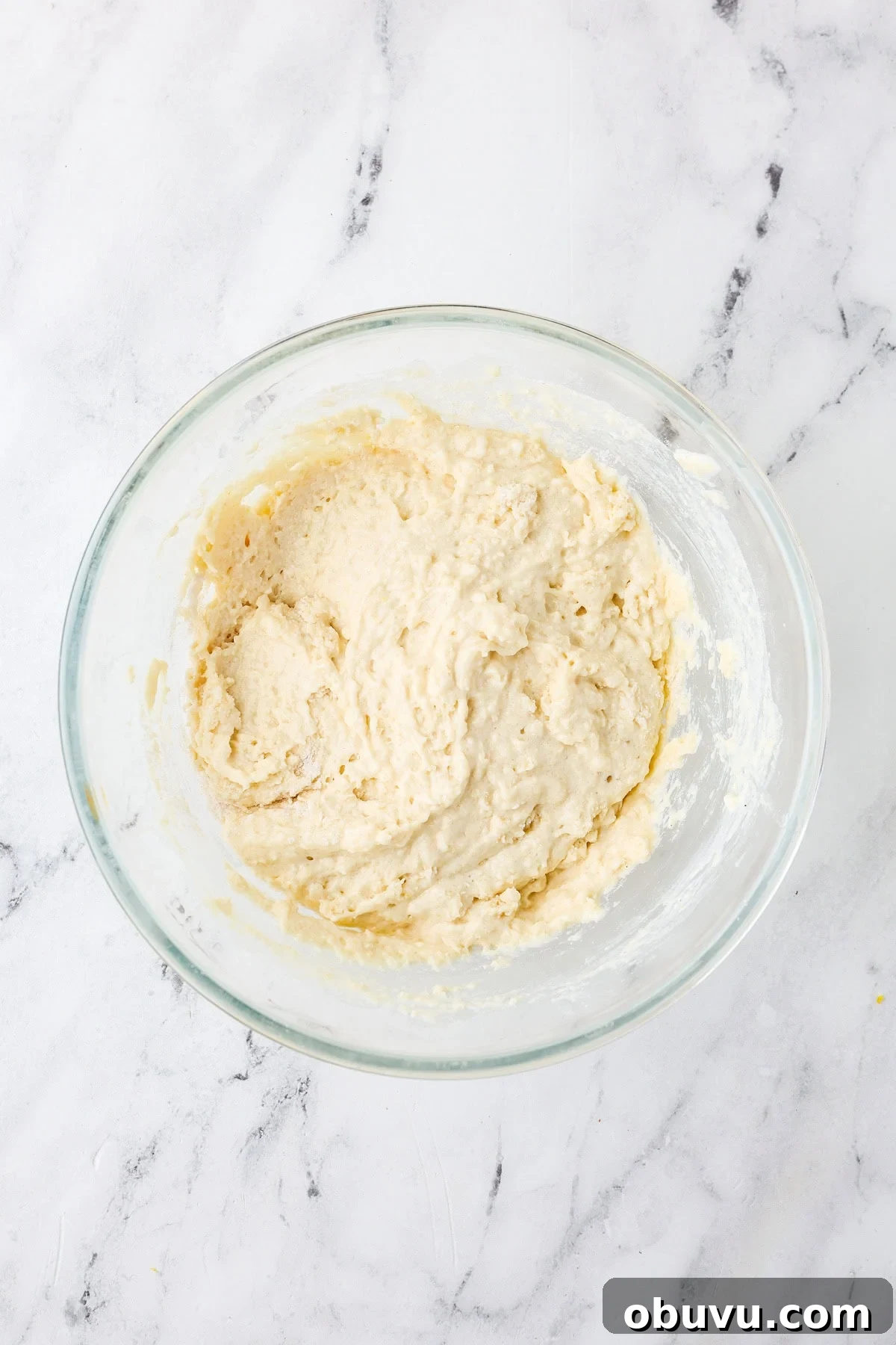 An overhead image of combining the wet and dry ingredient mixture in a bowl.